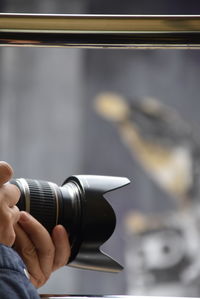 Close-up of man photographing airplane