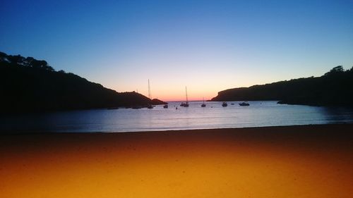 Scenic view of beach against sky during sunset