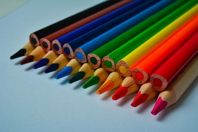 Close-up of colored pencils on table