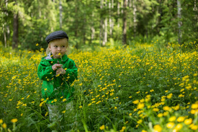 Boy standing on field