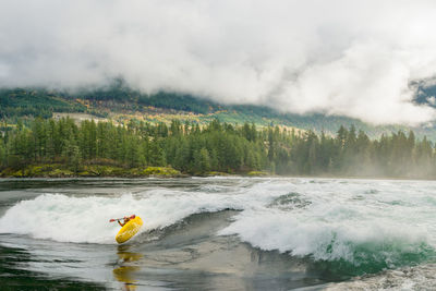 Kayaker white-water kayaking in skookumchuck rapids