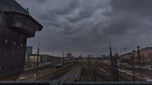 Cityscape against cloudy sky over munich main station