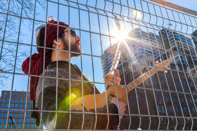 Low angle view of man against bright sun