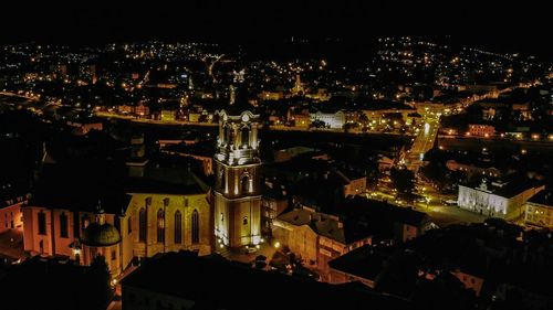 High angle view of illuminated buildings in city at night