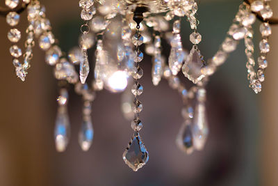 Close-up of chandelier hanging on ceiling