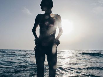 Woman standing on beach