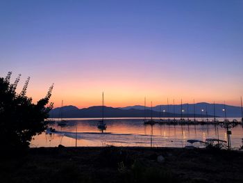 Silhouette of marina at sunset