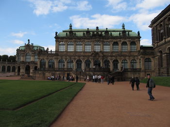 Group of people in front of historical building