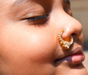 Close-up portrait of girl wearing nose ring