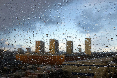 Full frame shot of wet glass window in rainy season