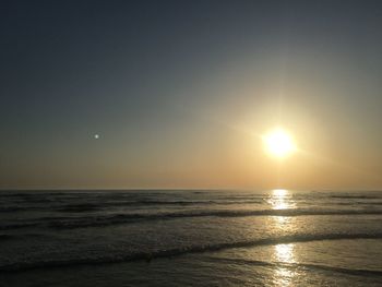 Scenic view of sea against sky at sunset