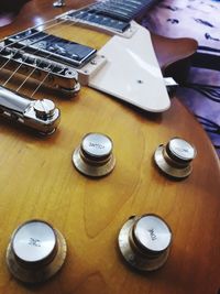 High angle view of guitar on table