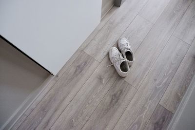 High angle view of shoes on hardwood floor