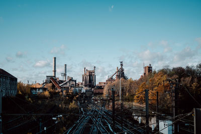 Train on railroad track against sky