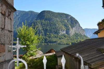 Panoramic shot of houses and mountains against clear sky