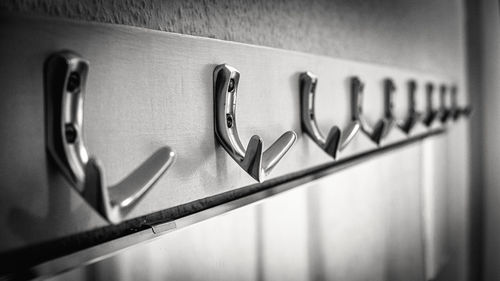 Close up of coat hooks in black and white. 