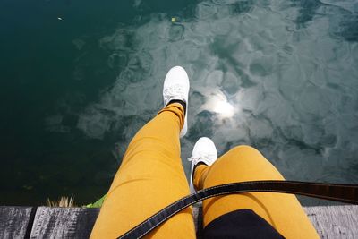 Low section of person on boat in lake