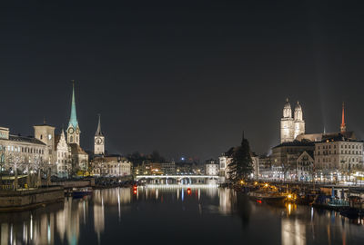 Illuminated buildings at waterfront