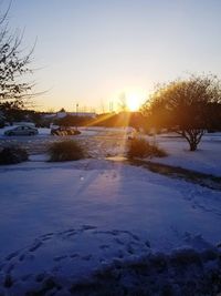 Scenic view of frozen lake against clear sky during winter