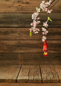 Close-up of cherry blossom on wooden table