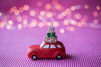 Close-up of toy car on purple fabric