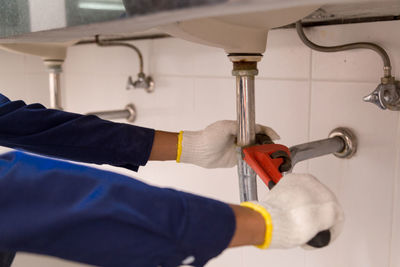 Man working in bathroom