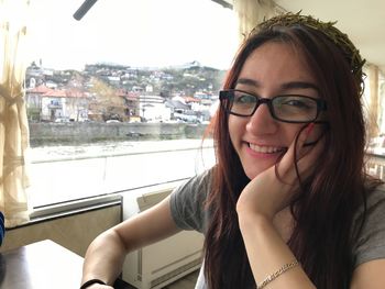 Portrait of smiling young woman in boat