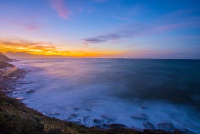 Scenic view of sea against sky during sunset