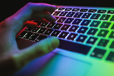 Close-up of hand using computer keyboard