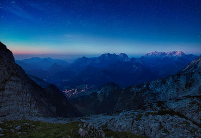 Scenic view of mountains against star field