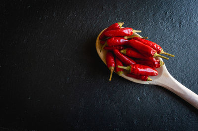 High angle view of red chili peppers on table