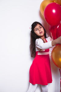 Smiling girl standing at home