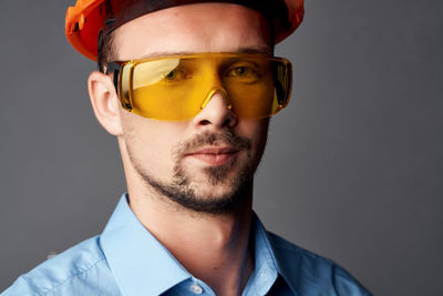 Close-up portrait of man wearing eyeglasses