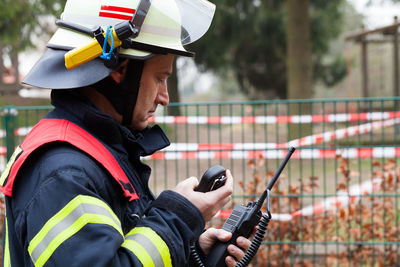 Firefighter using walkie-talkie