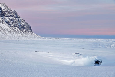 Scenic view of snow covered mountain against sky