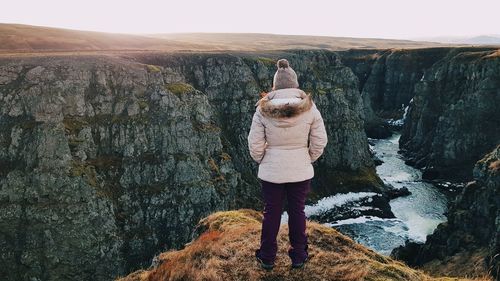 Woman contemplating the kolugljúfur canyon