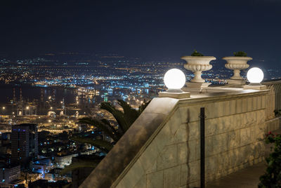 High angle view of illuminated buildings in city at night