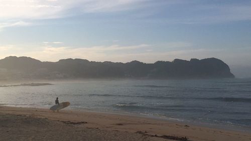 Scenic view of beach against sky