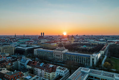 Sun setting behind the state chancellory in munich, germany