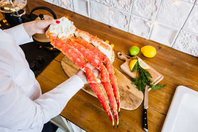 High angle view of woman preparing food on table