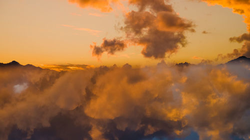 Low angle view of dramatic sky during sunset