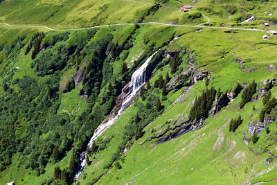 High angle view of green landscape against sky