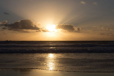 Scenic view of sea against sky at sunset