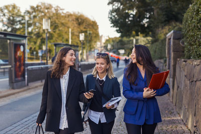 Female coworkers walking together