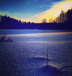 Scenic view of lake against sky during winter
