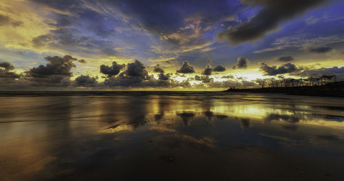 Scenic view of sea against sky at sunset