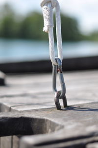 Close-up of ropes tied on wood