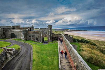 Panoramic view of tourists on beach