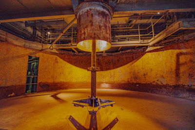 Close-up of rusty machine part of abandoned factory