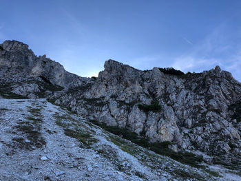 Scenic view of mountains against blue sky